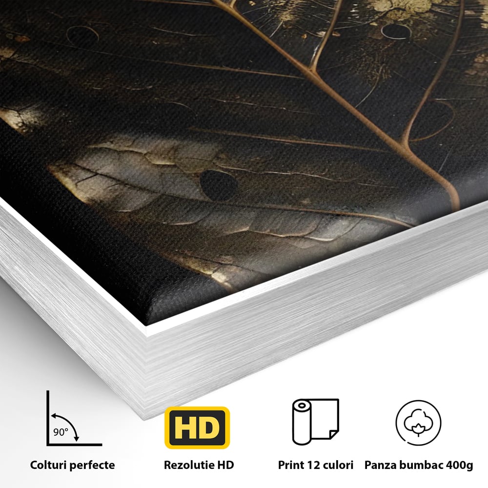 Detaliu al suprafetei: tablou canvas cu frunza aurie pe fundal negru, in rama de aluminiu argintiu